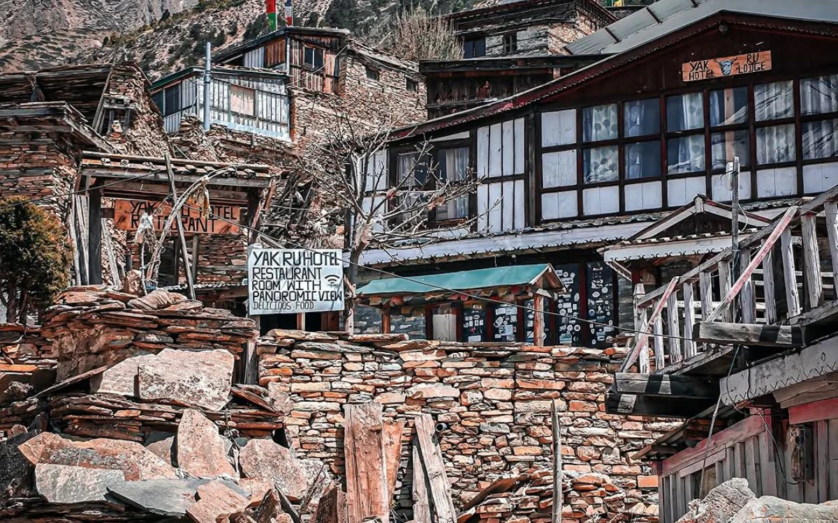 Teahouse lodge with rooms and restaurant signage on the Annapurna Circuit