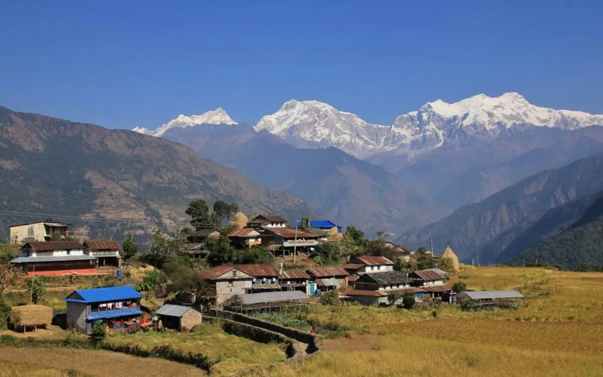 Mountain village with teahouses and lodges against Himalayan backdrop