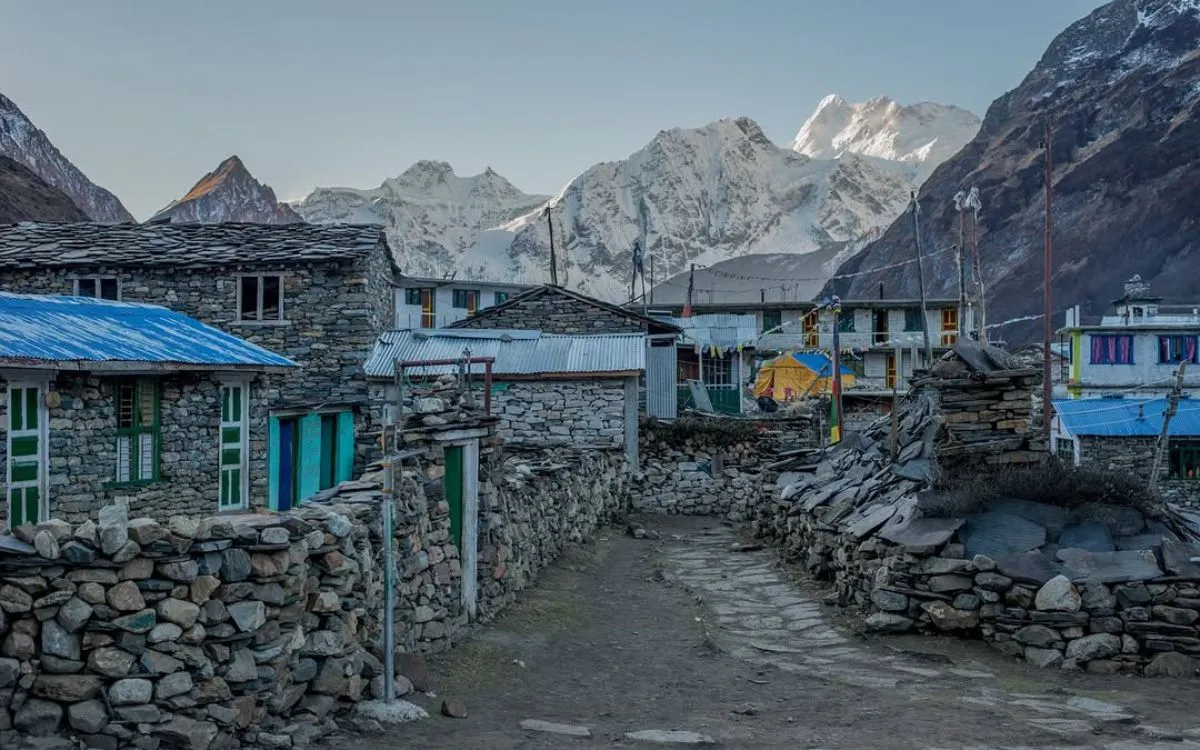 Stone teahouse buildings in high-altitude Manaslu village at dusk