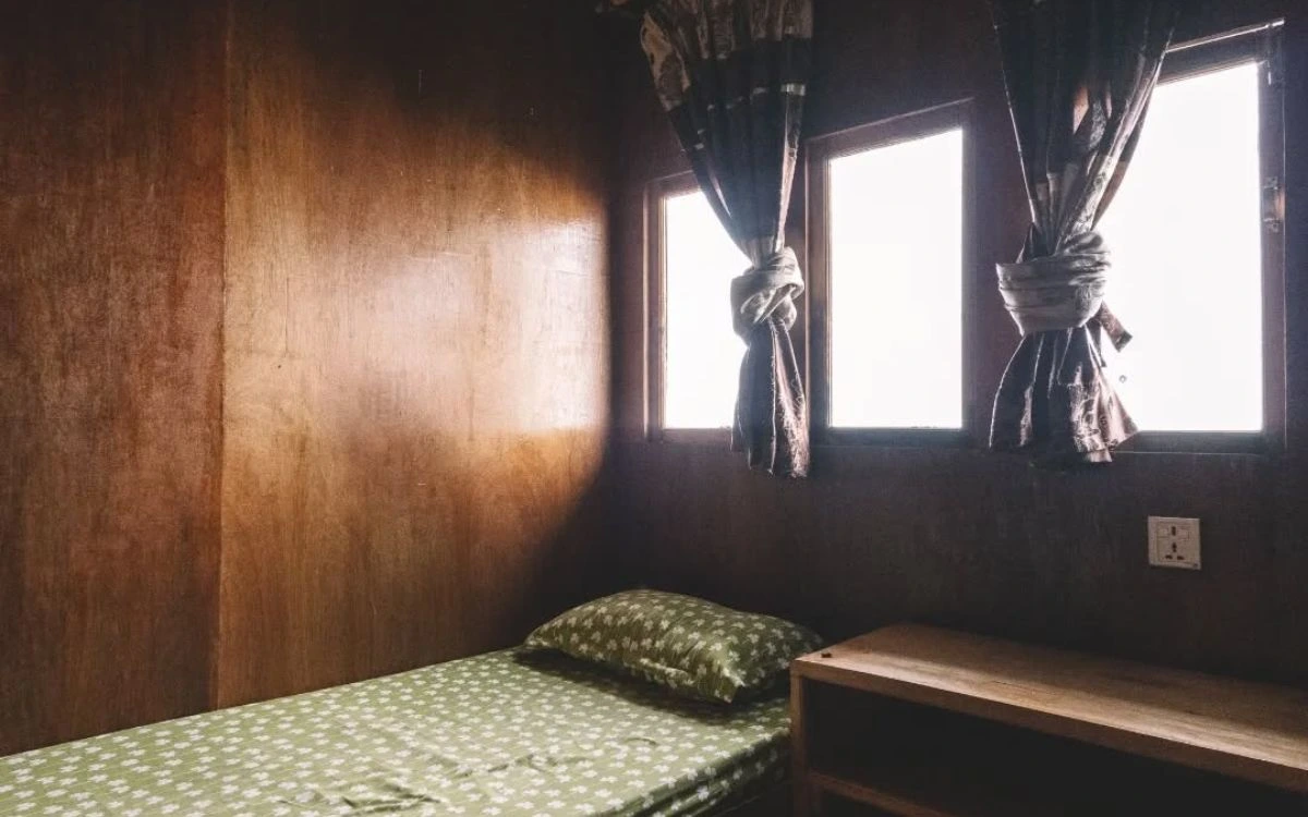 Simple teahouse room with twin beds on Pikey Peak Trek