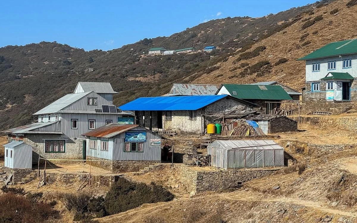 Teahouses at Pikey Peak Base Camp with mountain backdrop