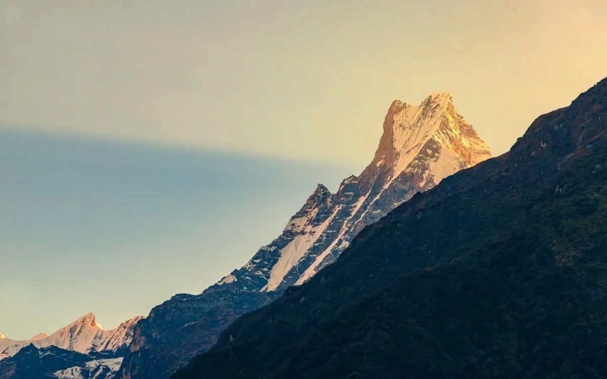 Golden sunrise light on Mount Machapuchare (Fishtail) in the Annapurna region