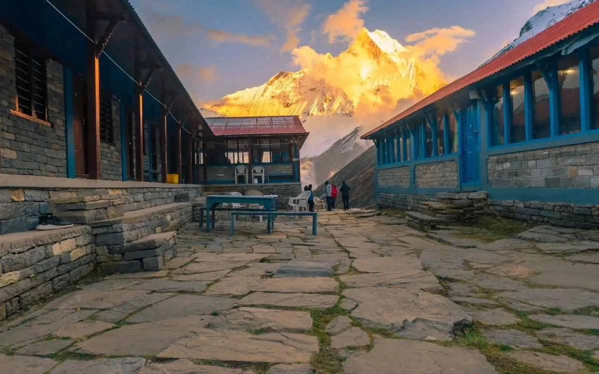 Teahouse lodges at Annapurna Base Camp glowing at sunset