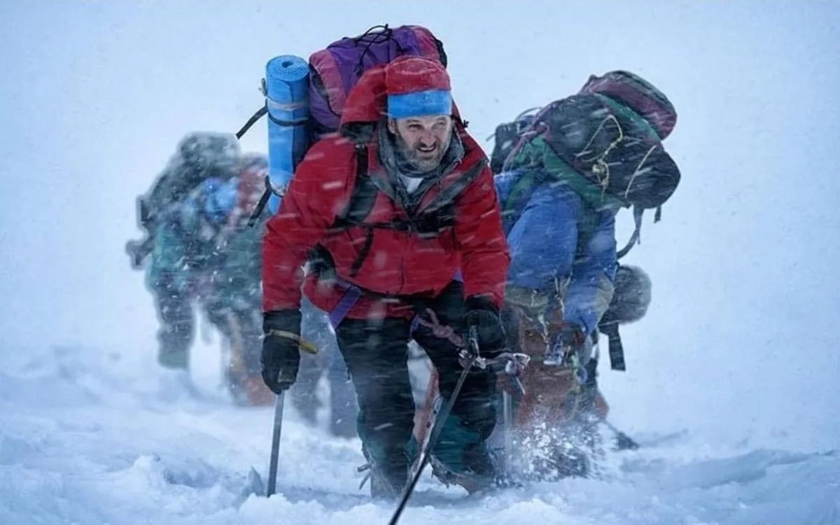 Scene from Everest expedition showing climbers in storm conditions