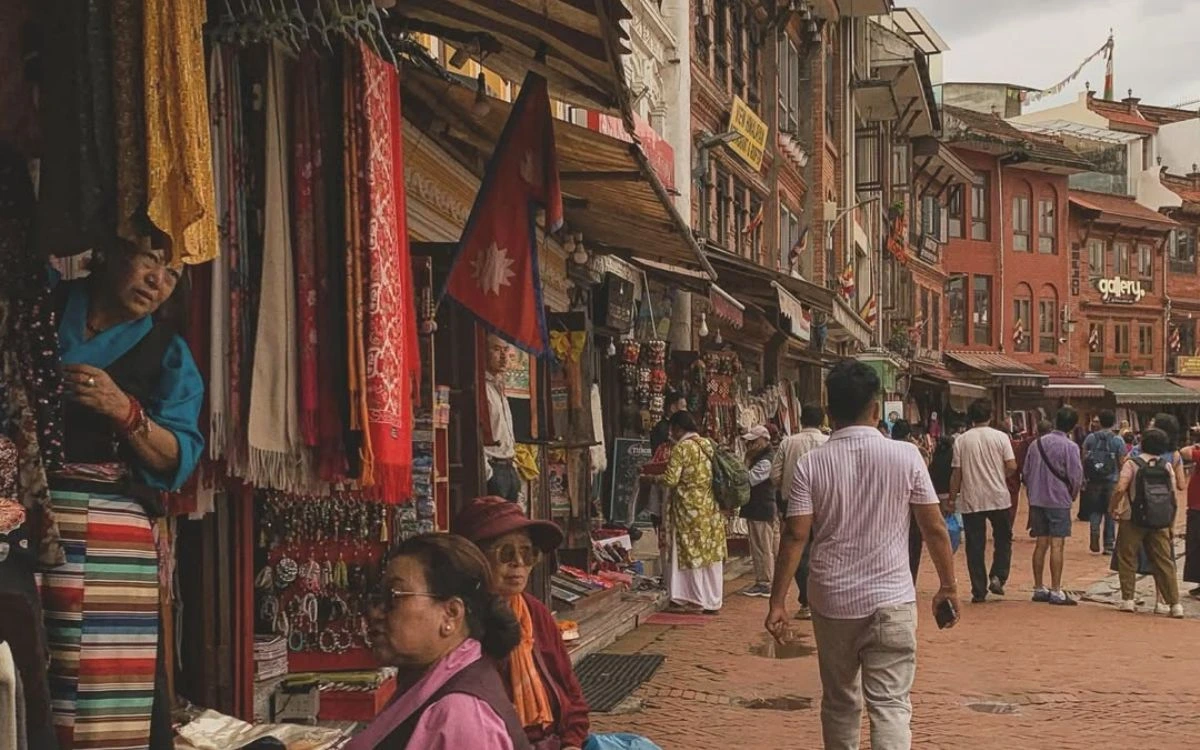 Local market street near Boudhanath Stupa with shops selling traditional Nepali handicrafts and souvenirs