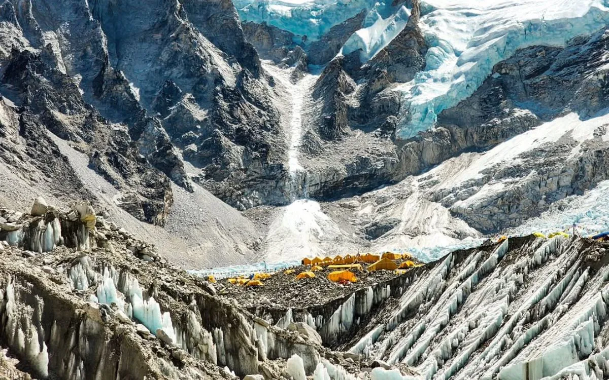 Everest Base Camp tents positioned above dramatic Khumbu Icefall formations