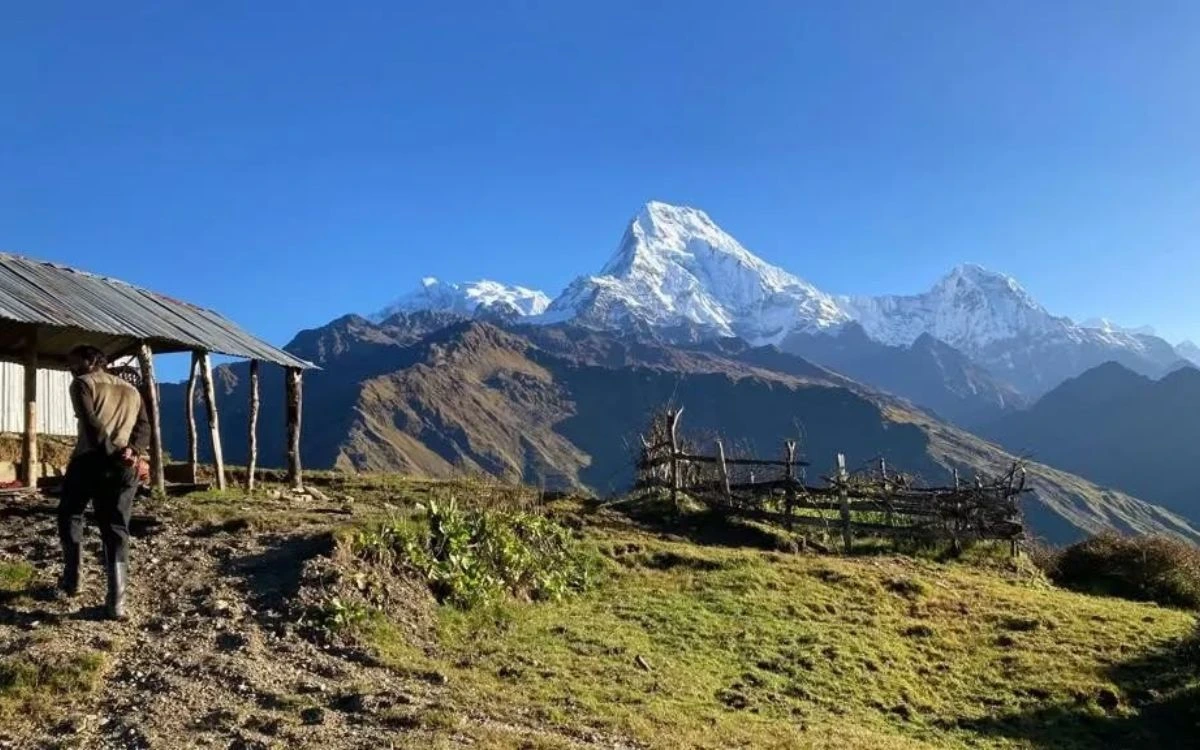 A mountain village teahouse with Annapurna South dominating the skyline