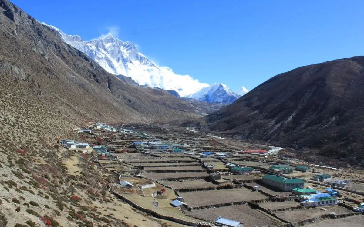 Dingboche terraced fields and settlement with Lhotse and Ama Dablam peaks