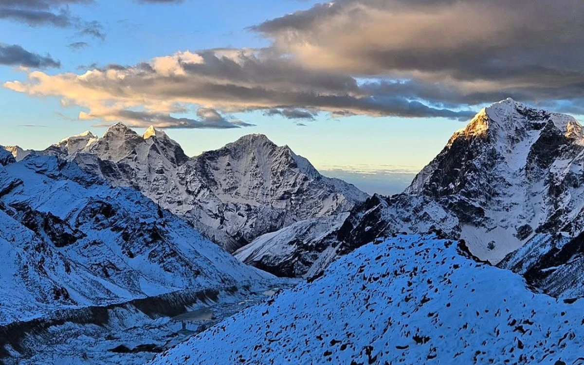 A dramatic sunrise over the snow-covered Mahalangur Himalayan range in the Khumbu region of Nepal