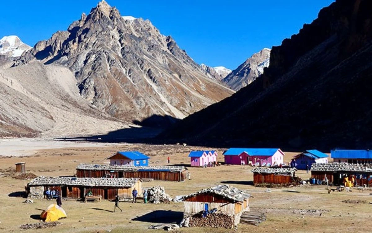 Colorful teahouse lodges and camping tent in a remote high-altitude village on the Kanchenjunga trek