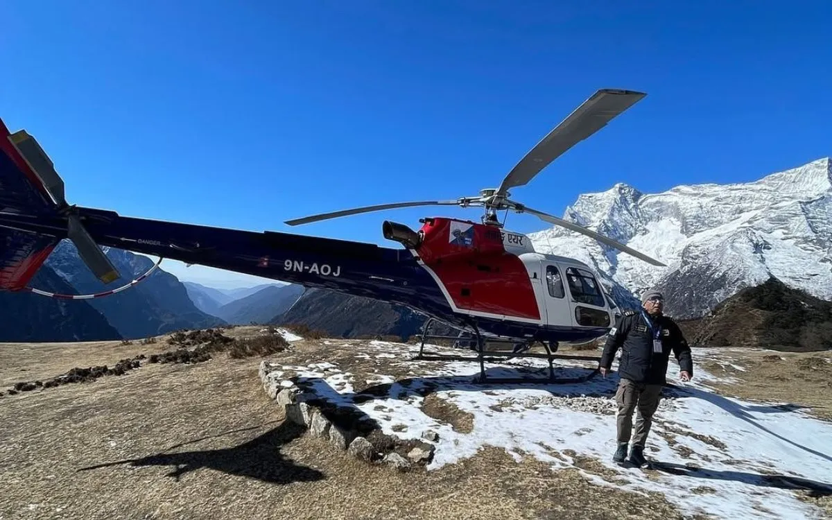 Simrik Air helicopter flying over the Himalayan mountains of Nepal