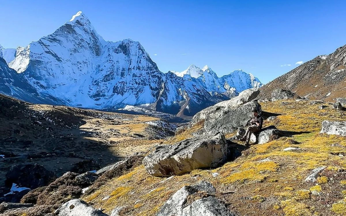 Golden alpine meadow below Ama Dablam peak on Kongma La Pass approach