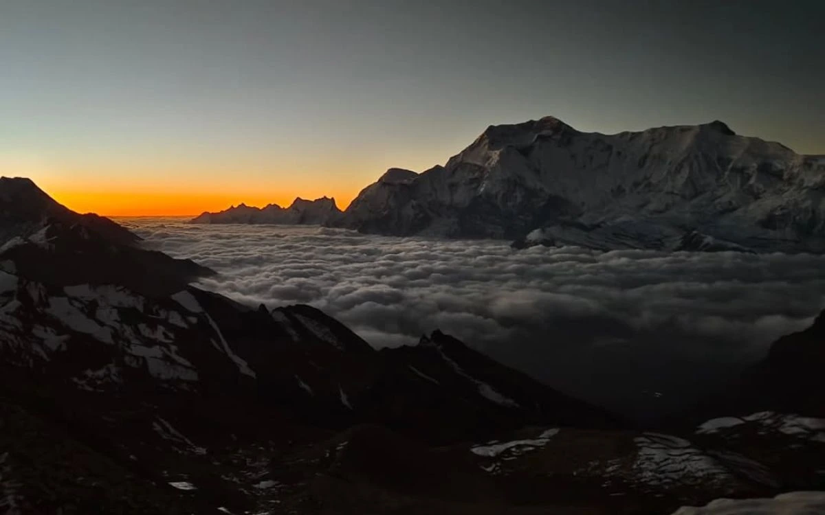 Sunrise over Himalayan peaks with sea of clouds below, Nepal trekking viewpoint