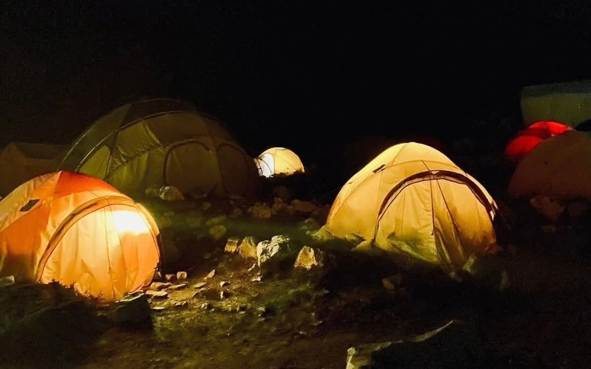 Lit tents at high camp during Island Peak climbing