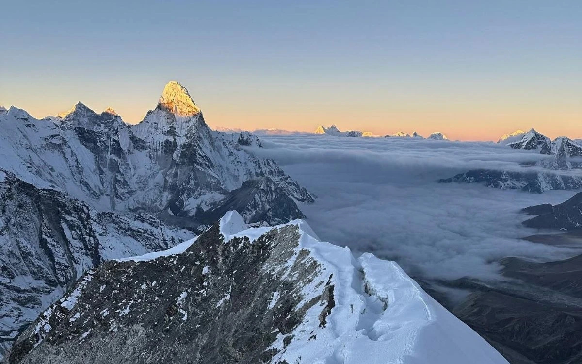 Sunrise view of Ama Dablam above the clouds from Island Peak