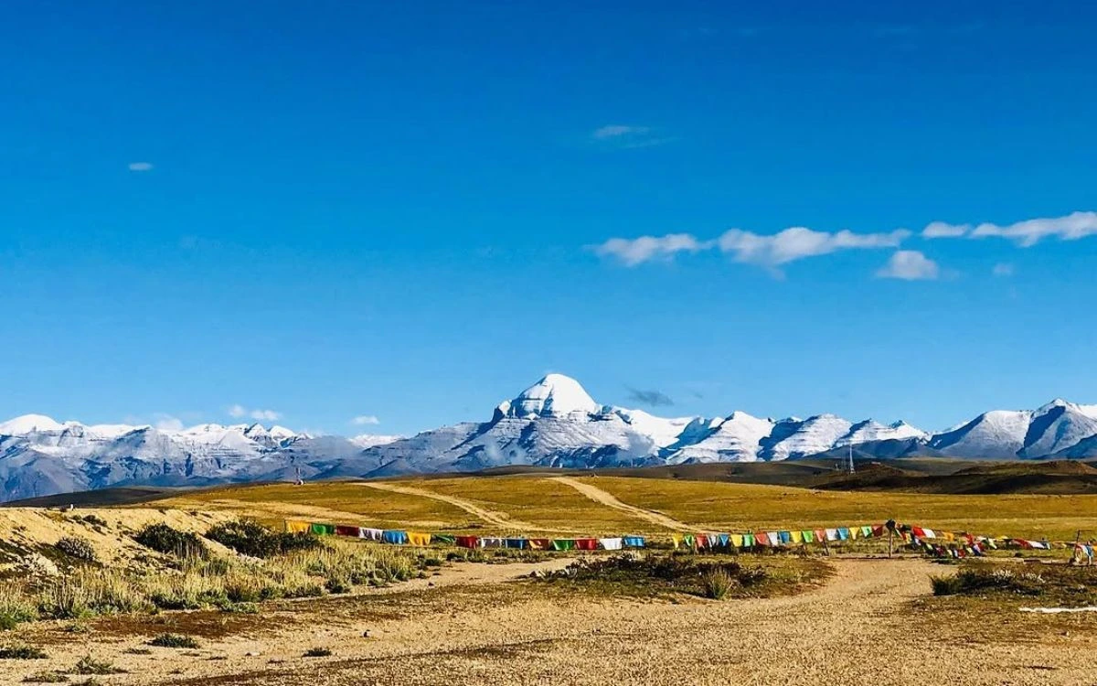 Prayer flags lining the plain with Mount Kailash on the horizon