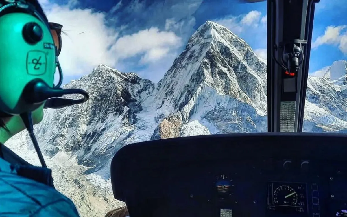 Helicopter cockpit view of Mount Everest and Himalayan peaks during Nepal mountain flight