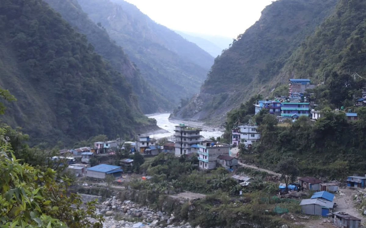 Machha Khola village nestled in river gorge at confluence of mountain valleys