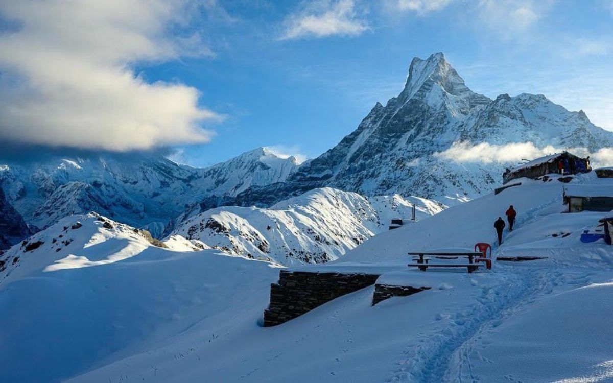 ​ Snow-covered lodge with Mardi Himal backdrop