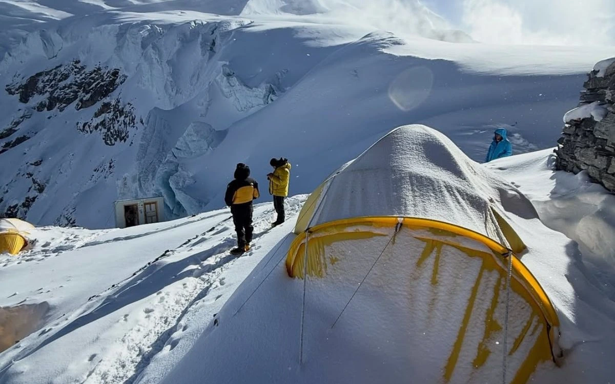 Climbers at snow-covered high camp during Mera Peak climbing