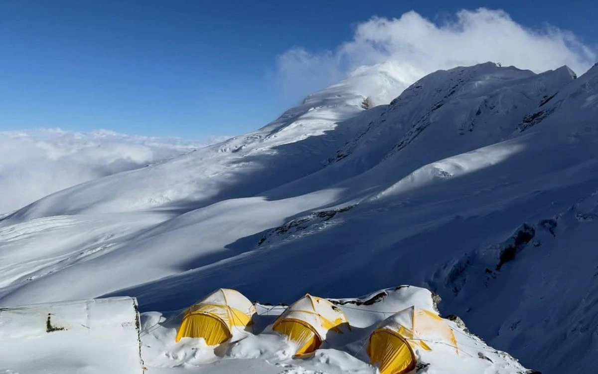 Snow-covered tents at high camp on the way to Mera Peak