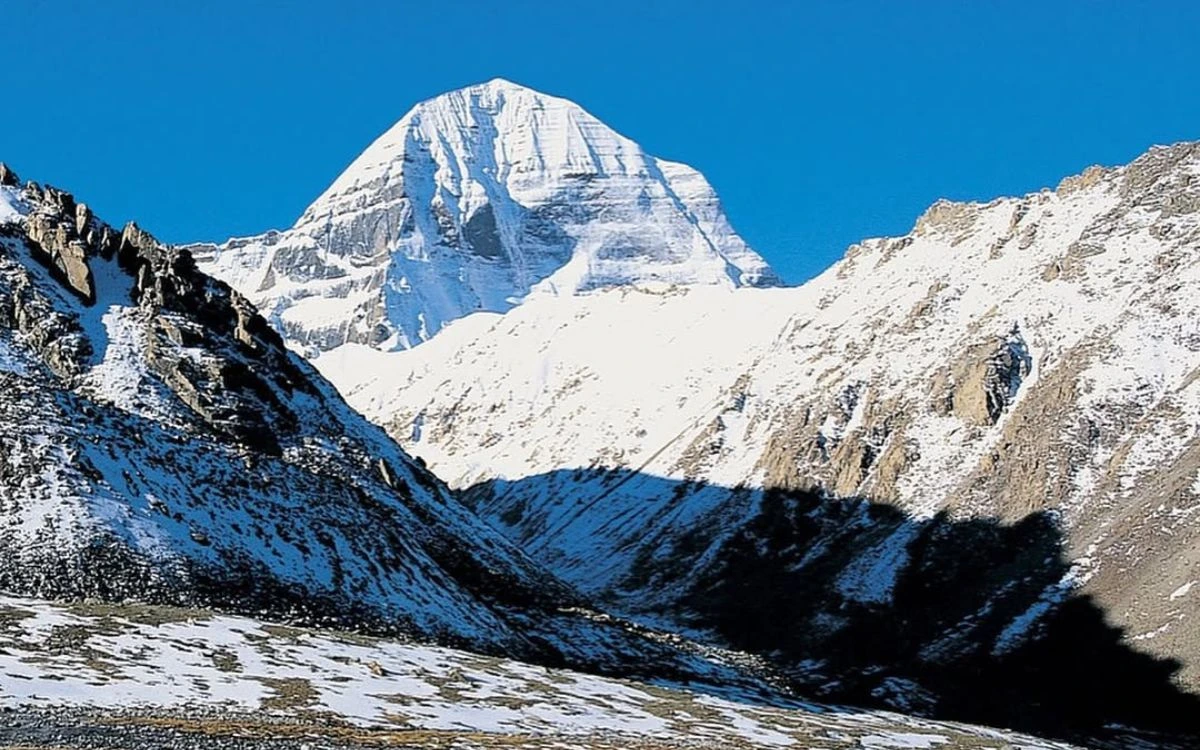 Pyramid-shaped peak of Mount Kailash under clear sky