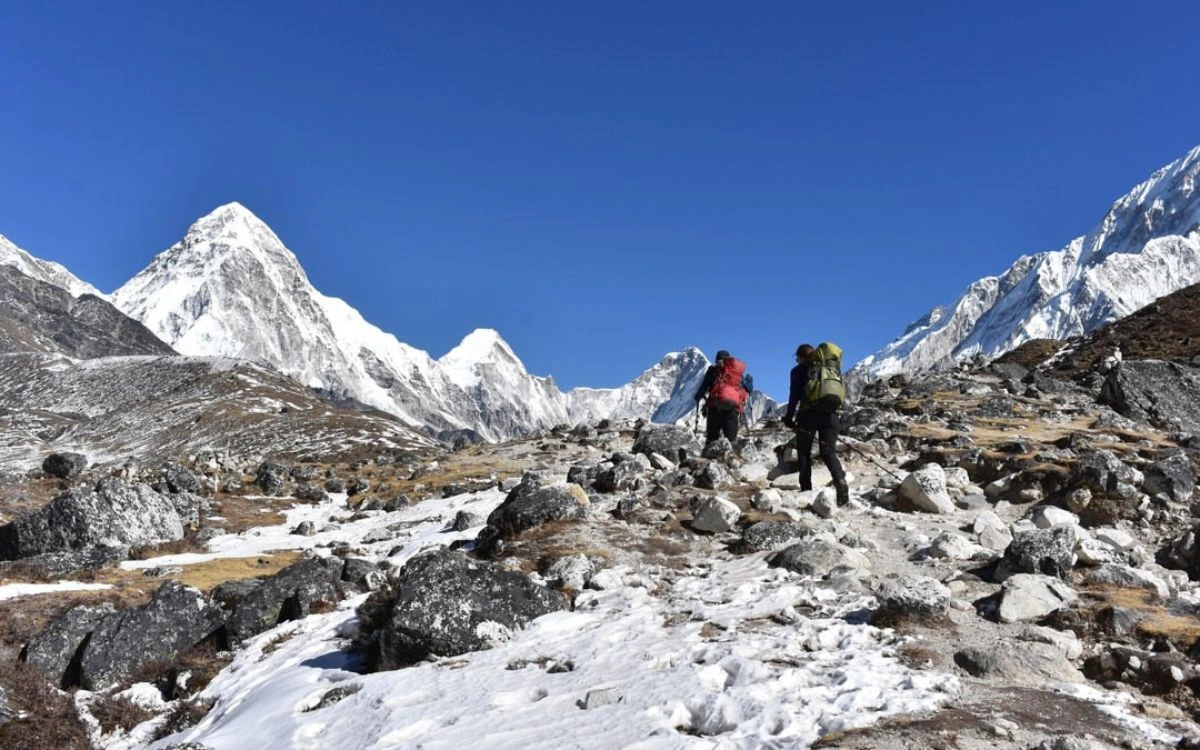 Hikers descending near Everest peaks during a Nepal trek in January