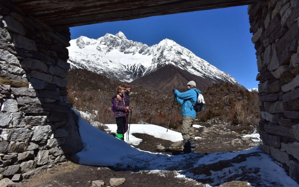 Trekkers viewing snowy Langtang peaks on a January trek in Nepal