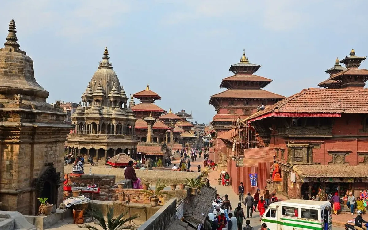 Krishna Mandir stone temple in Patan Durbar Square on a sunny day.”