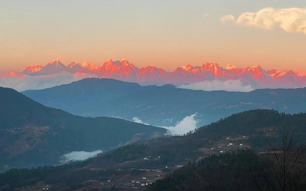 Alpine glow on snow-capped Himalayan peaks at sunset from Pikey Peak