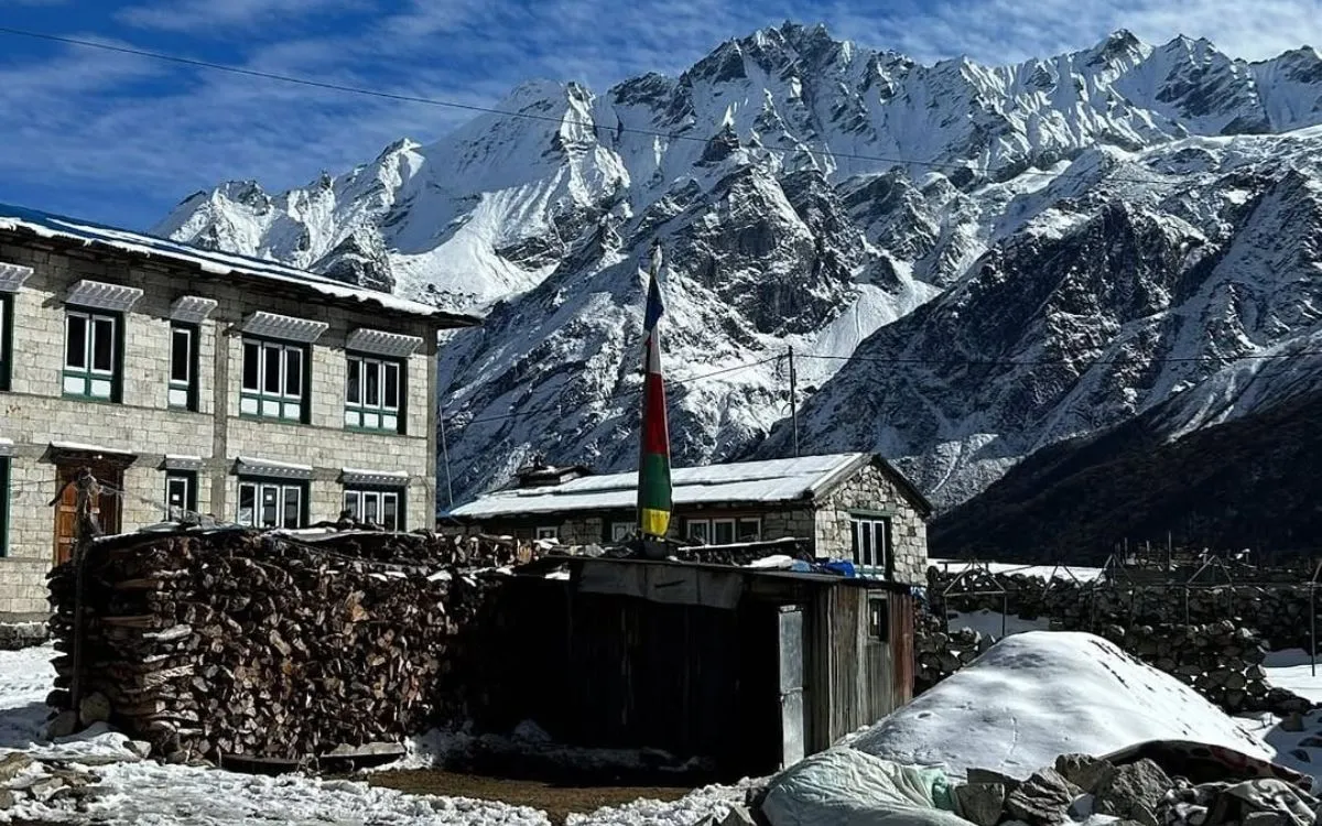Traditional stone lodge with prayer flags in Langtang village
