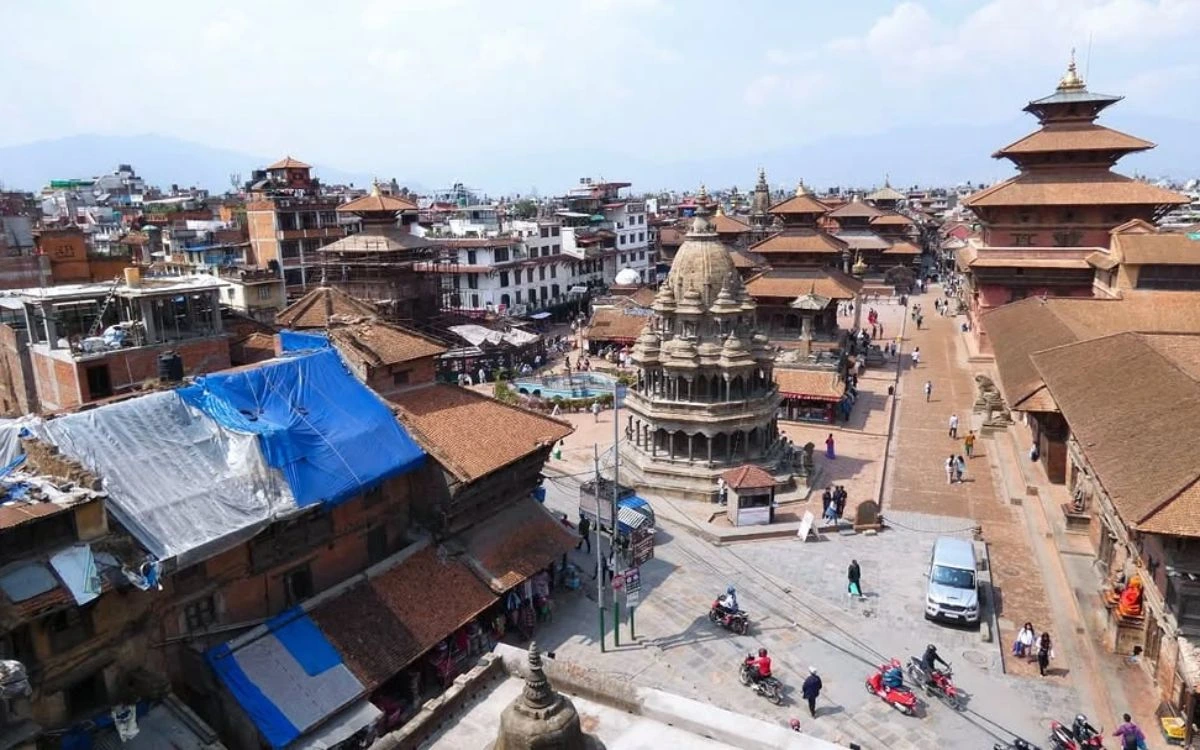 Aerial view of Patan Durbar Square with ornate pagoda temples, brick streets, and the city of Lalitpur