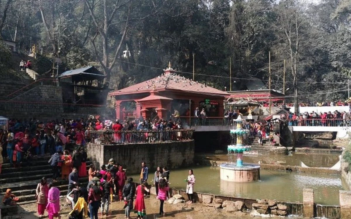 The main temple complex of Dakshinkali featuring a red pagoda-style roof and a central fountain.