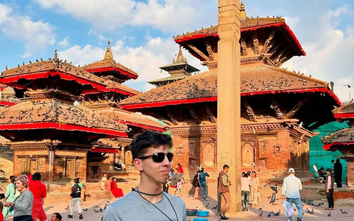 Man in front of multiple pagoda temples in Square