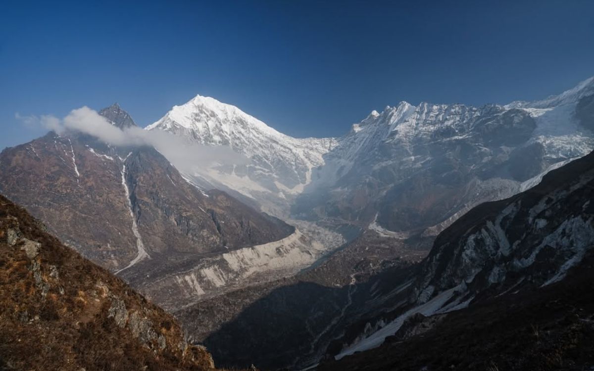 Kyanjin Ri mountain panorama with snow-capped Himalayan peaks and glacier valley in Nepal