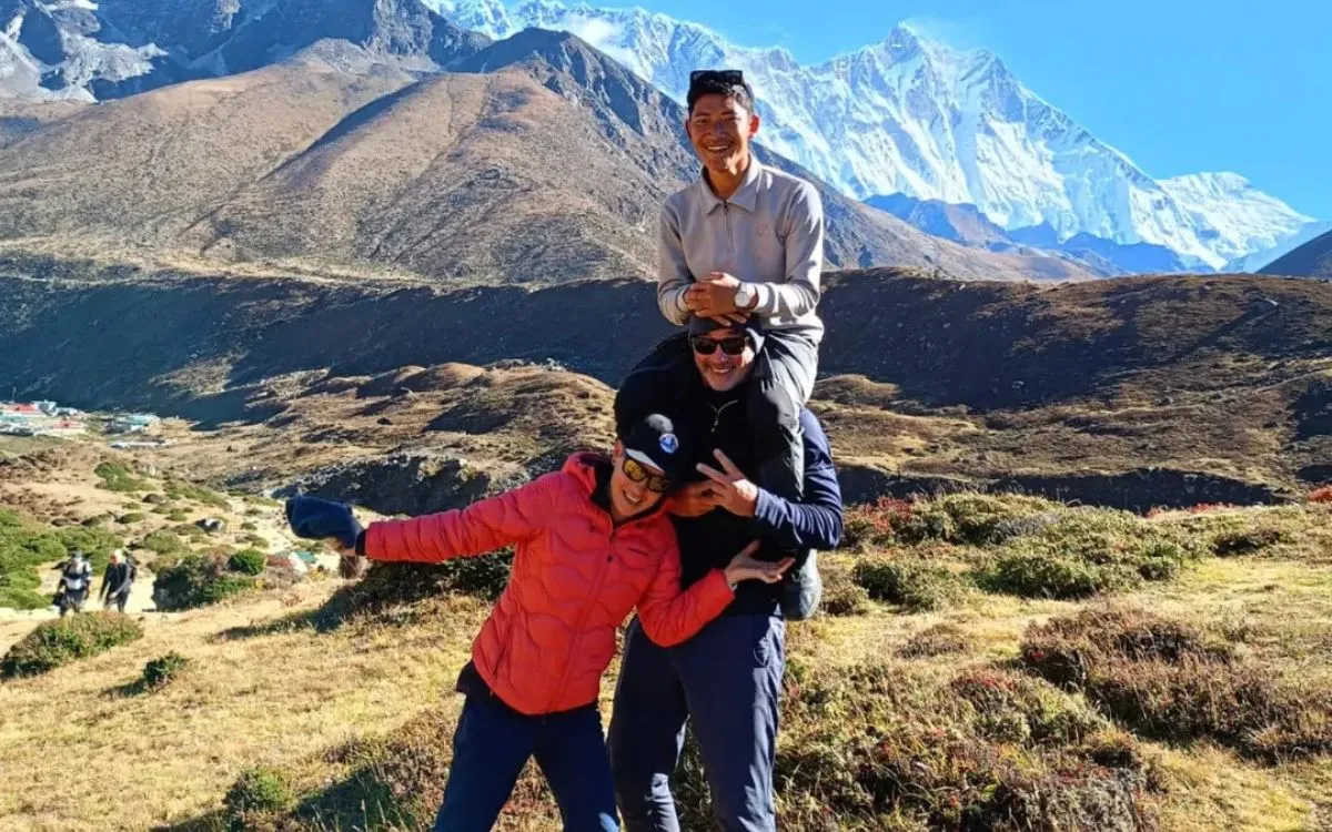 Group of trekkers with local Nepali guide in the Himalayas