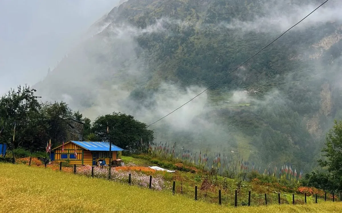 Mountain teahouse surrounded by mist in Manaslu region