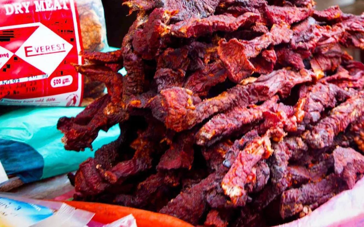 Homemade beef jerky strips ( Sukuti ) with dehydrator packaging
